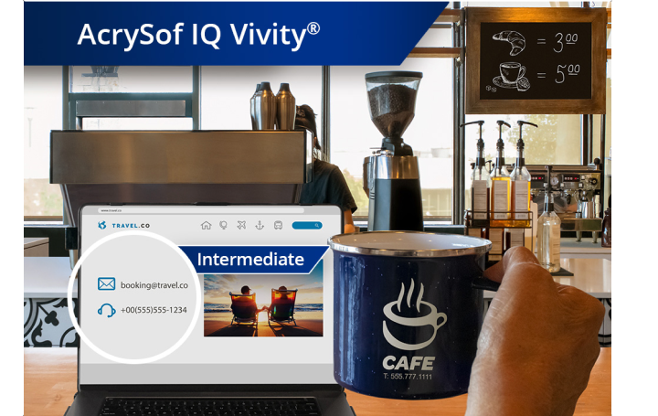 Clear image of a coffee shop with a view from the counter of coffee machines and other ingredients. A laptop is open on the countertop and an individual’s hand holds up a coffee mug to the right of the laptop screen. White text at the top left corner of this image reads “AcrySof IQ Vivity.”