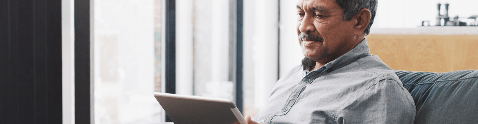Elderly man with a tablet