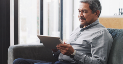 Elderly man with a tablet