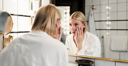 woman removing contact lenses