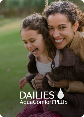 Woman hugging child smiling