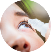 Close-up of eye and eye drops