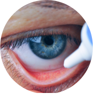 Close-up of eye and eye drops