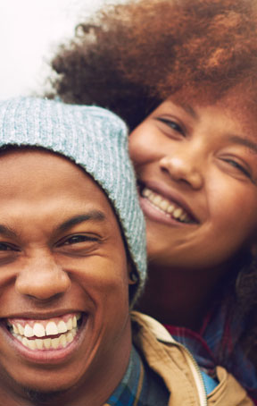 Couple smiling hugging