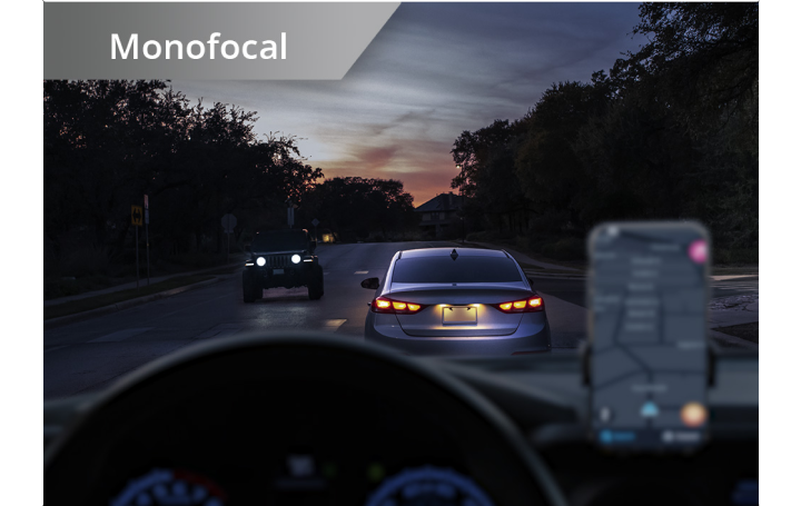 Two identical pictures side by side from the point of view of someone driving at night.  The picture on the left displays the night-driving vision of someone with a monofocal IOL, with near objects out of focus. The image on the right displays the night-driving vision of someone with a Clareon Vivity IOL, with near, intermediate and distance focal points in focus.