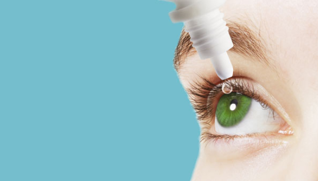 Close up of eye and eye drops