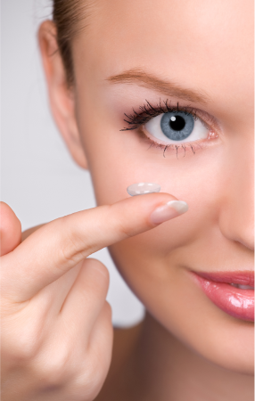 Woman holding lens on her finger