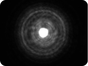 Black background with a bright light in the middle, with a halo around the light larger than the Clareon Monofocal and Clareon Vivity IOLs, representing the optical bench halo measurement for TECNIS Symfony Diffractive IOL.