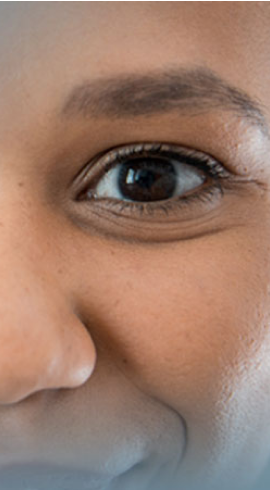 An up-close image of an individual’s eye, staring straight ahead