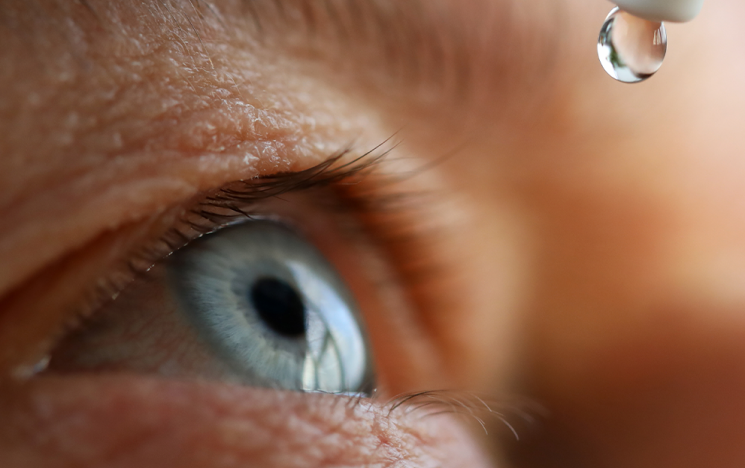 Elderly eye close up eye drop
