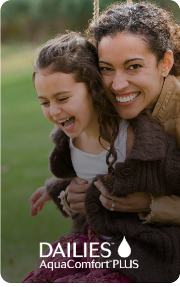 Woman hugging child smiling