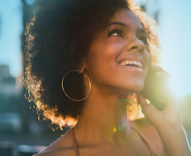 Young woman smiling on the phone