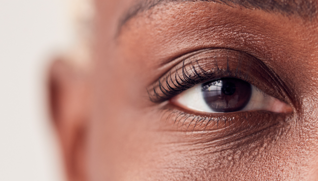 An close-up image of a person’s face with their eye in focus