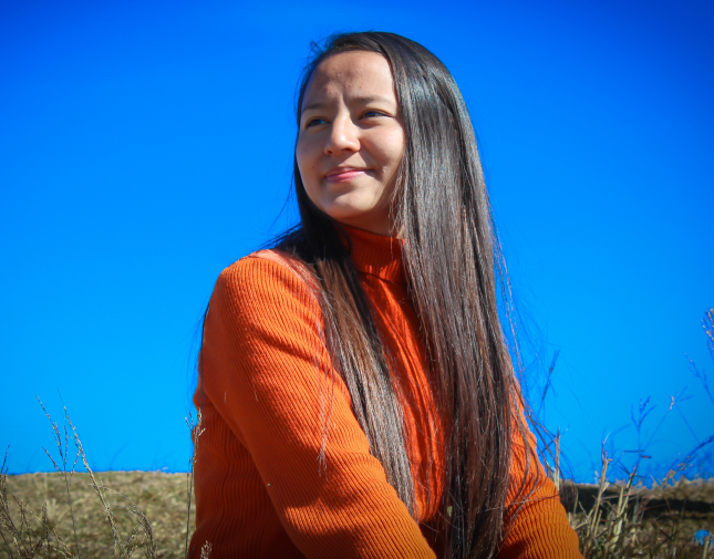 girl in an orange sweater