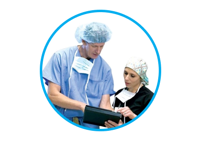 An image of man and woman wearing a black and blue scrubs. They are both looking at something on a tablet.