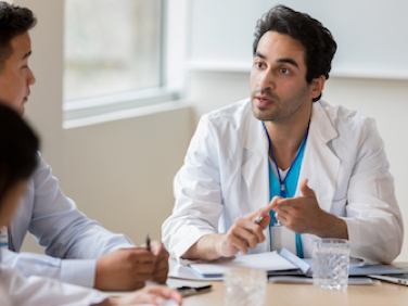 Ophthalmologist talking to the patient