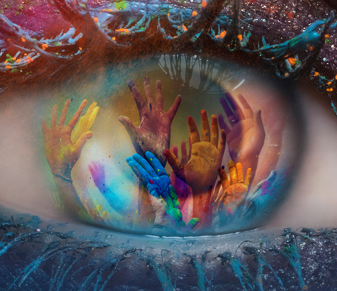 Close-up of an eye with a colorful artistic reflection of raised hands in the iris