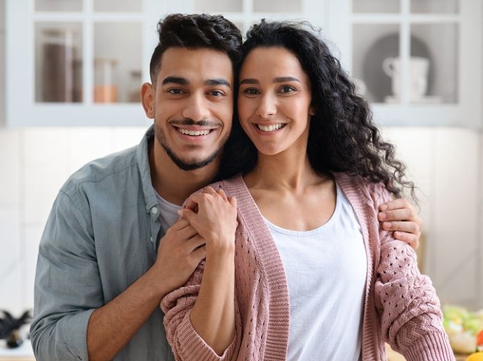 A smiling woman with black hair