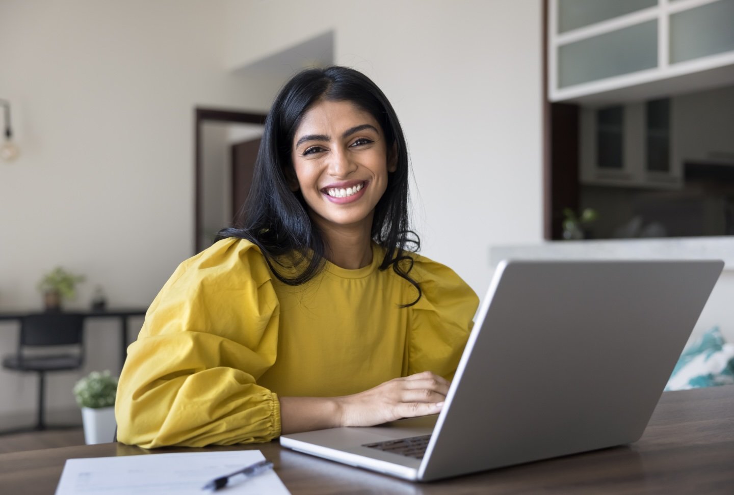 Smiling woman with a laptop