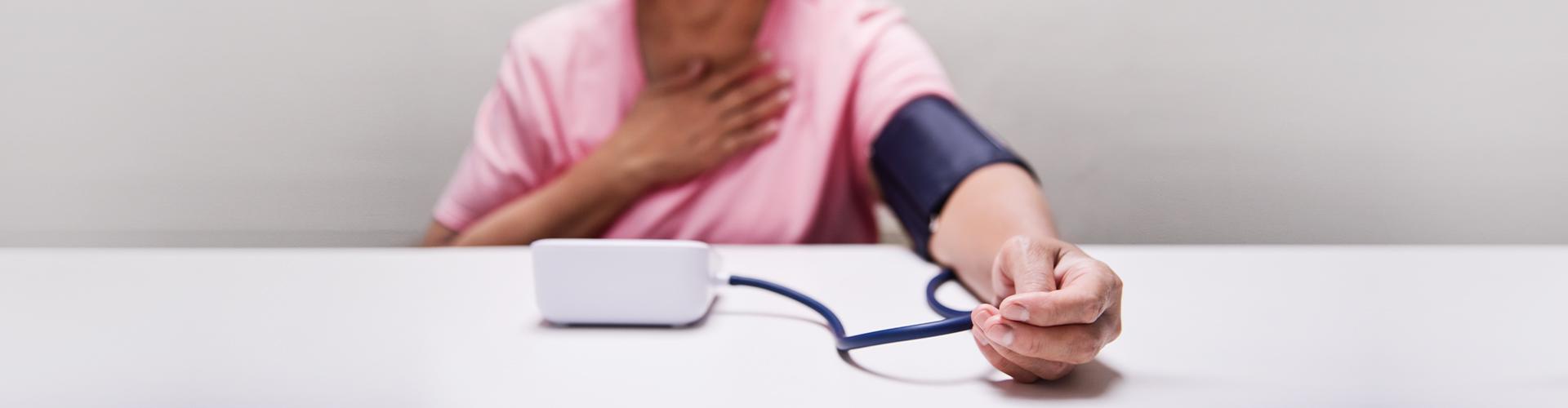 Elderly person while measuring blood pressure