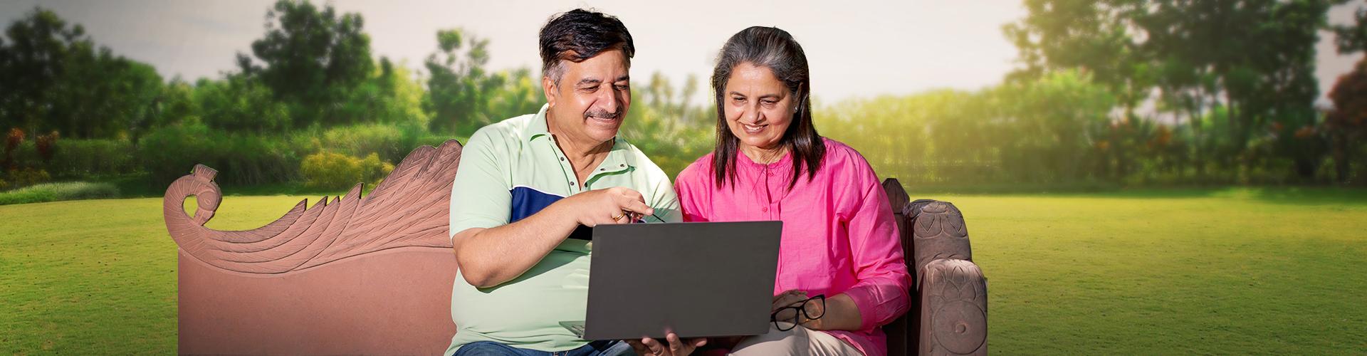 Elderly couple choosing the right lenses on the computer