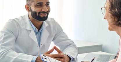 A doctor talking to an elderly person