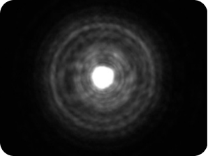 Black background with a bright light in the middle, with a halo around the light larger than the Clareon Monofocal and Clareon Vivity IOLs, representing the optical bench halo measurement for TECNIS Symfony Diffractive IOL.