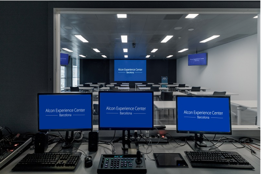 Image of studio with computers with AEC logos on monitors
