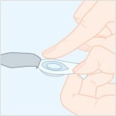 Contact lens placed on the fingertip, being lifted straight up