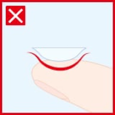 Demonstration of how using nails can harm a contact lens