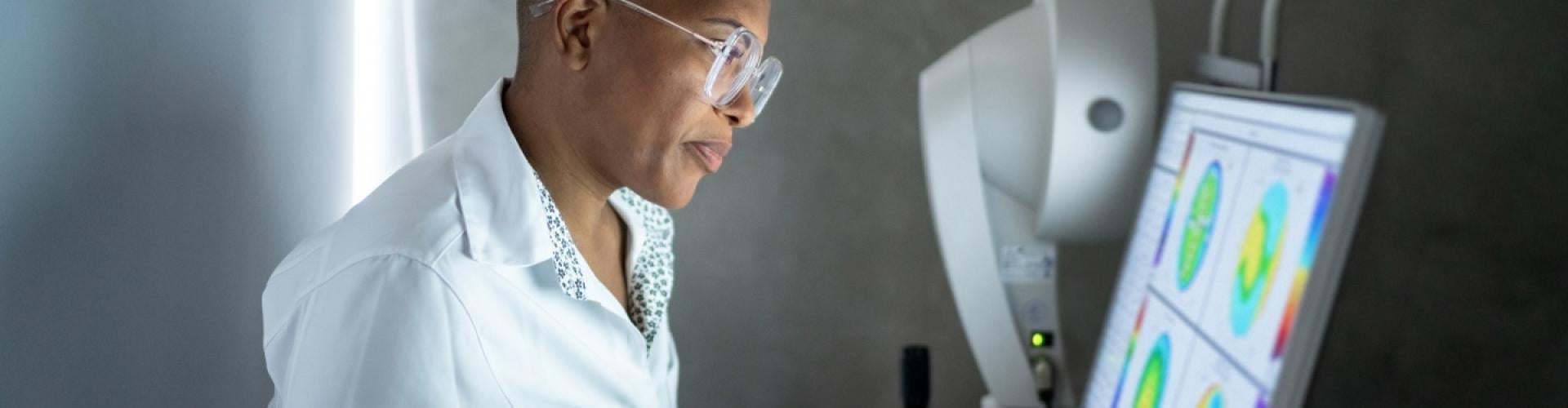 Ophthalmologist at medical equipment