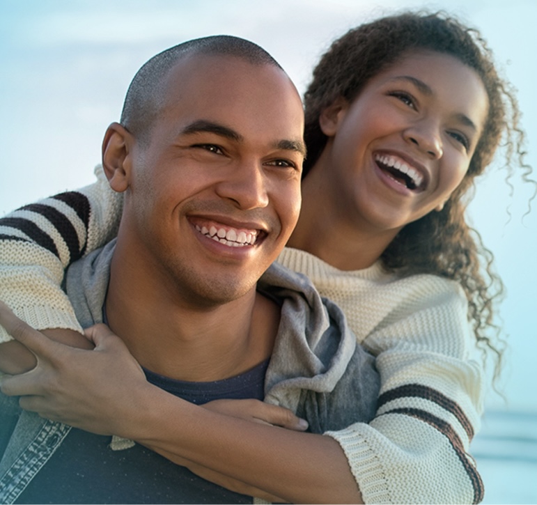 Couple smiling hugging