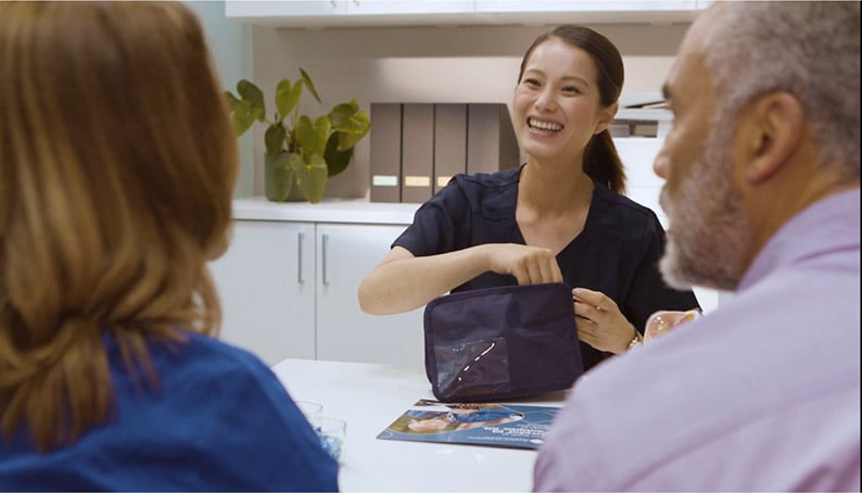 Man and woman meeting with an eye doctor
