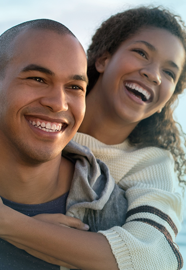 Couple smiling hugging