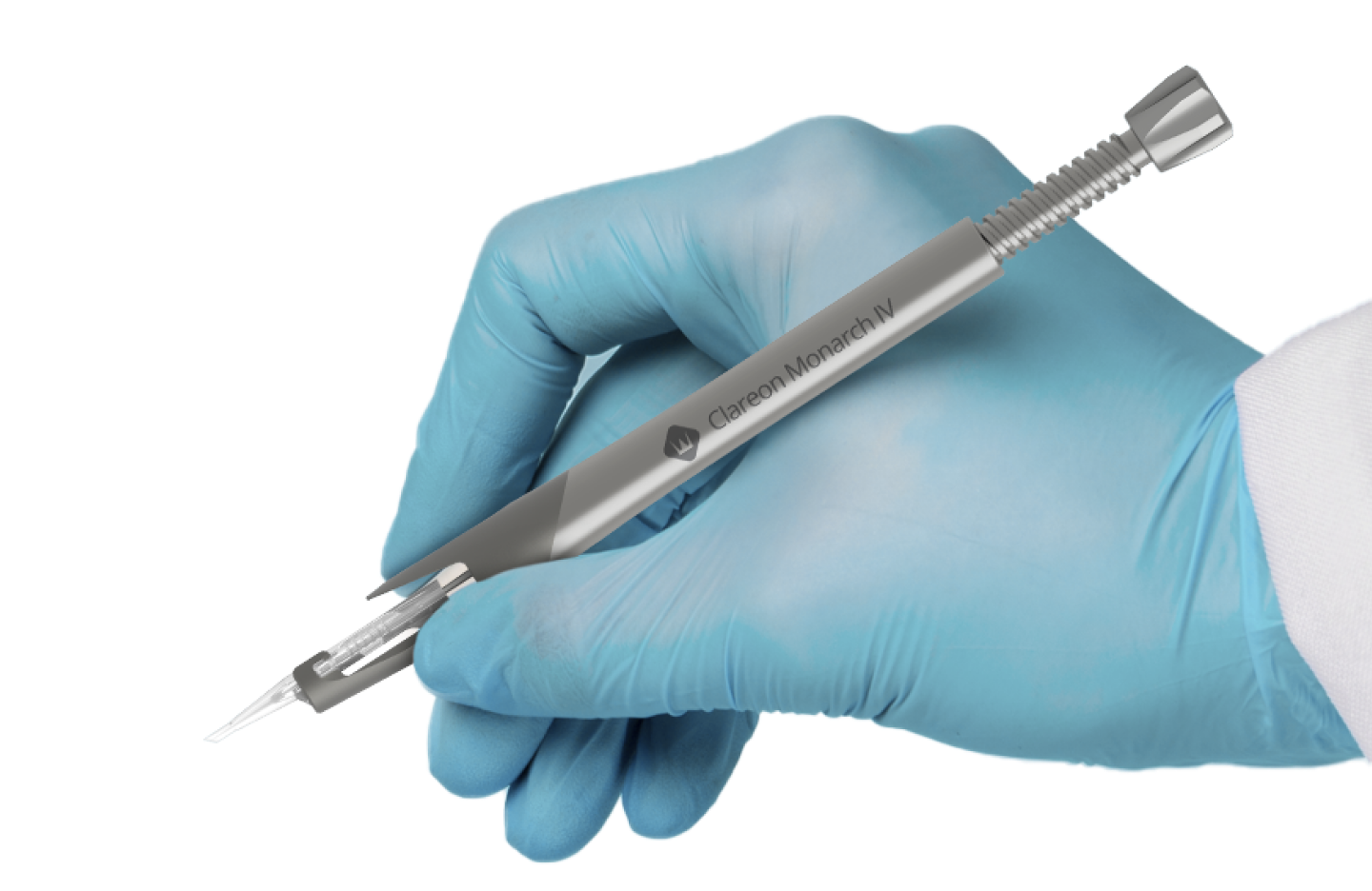 Hand wearing a disposable glove holding a Clareon Monarch IV Handpiece, pointing downwards.