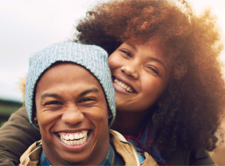 Couple smiling hugging