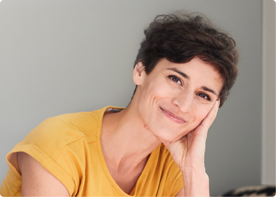 Woman in yellow shirt smiling