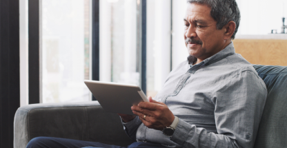 Elderly man with a tablet