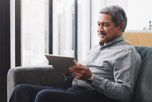 Elderly man with a tablet