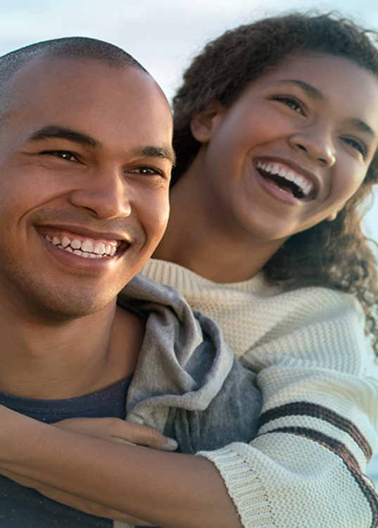 Couple smiling hugging