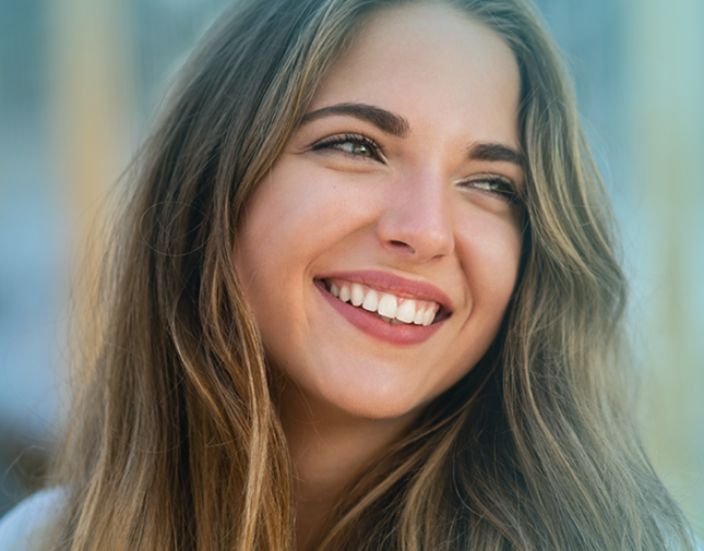 Woman smiling looking off into distance