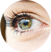 Closeup shot of a green eye experiencing dry eye, looking to the distance