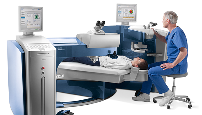 Doctor looking into a Wavelight® Refractive Suite machine