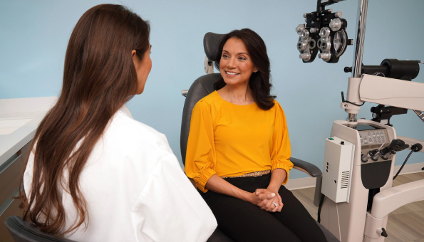 Woman consulting with optometrist at eye exam appointment