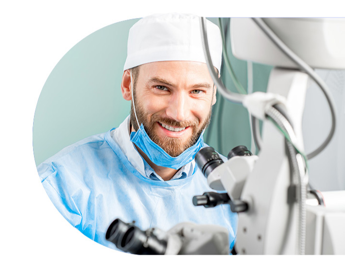 Surgeon at a microscope