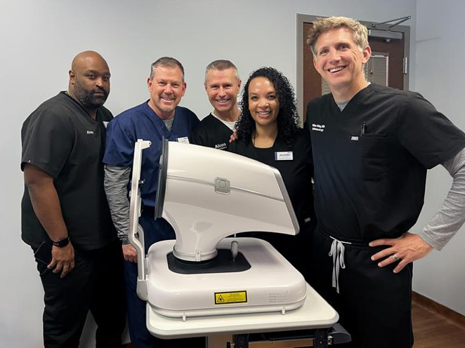 Group of smiling people at alcon product