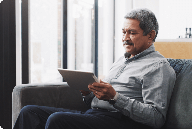 Elderly man with a tablet