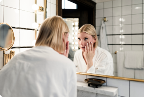 Woman removing contact lenses