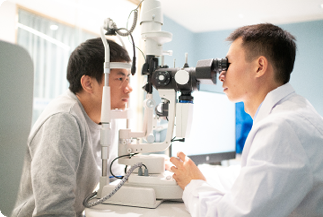 Ophthalmologist and patient during eye exam