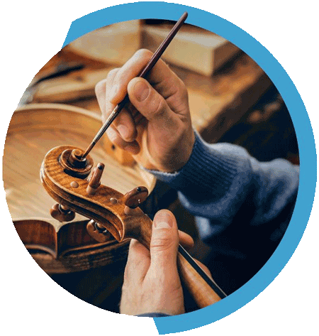 Circular image of man painting a violin with blue border